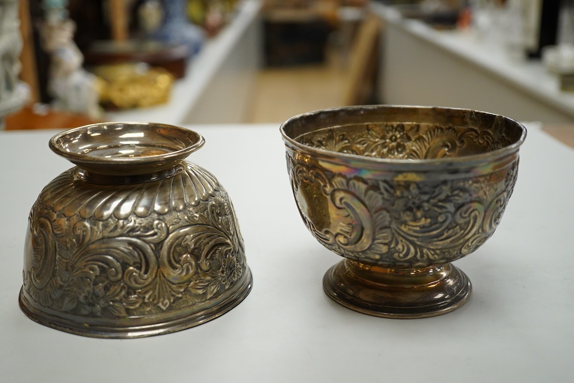 A pair of Edwardian repousse silver pedestal bowls, by Charles Boyton & Son Ltd, London, 1906, diameter 11.4cm(a.f.), 6.9oz and a plated two handled dish.